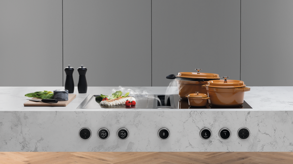Aspiration intégrée BORA dans un plan de travail de cuisine contemporaine
